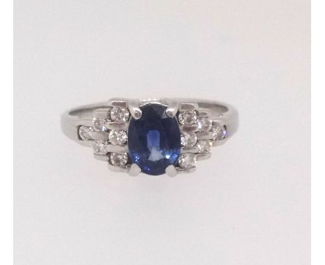 A sapphire and diamond set ring, set in 18ct white gold, size M.