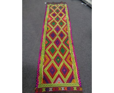 A Suzni kilim runner 284cm by 76cm