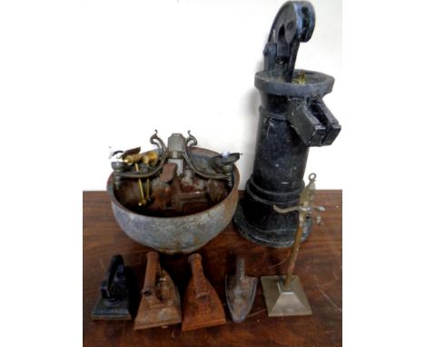 A wooden water pump together with antique and later metal ware, light fitting, irons, companion stand etc 