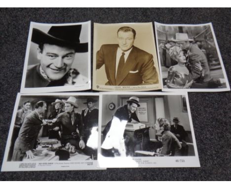 Photographs of John Wayne from films with Keystone, Globe, and Pictorial press stamps on verso.   