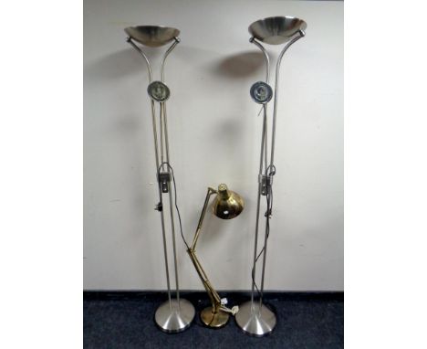 A pair of up lighters and a brass angle poised lamp 
