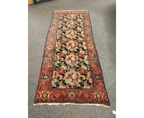A Persian runner with Abusson central field 94 cm x 234 cm