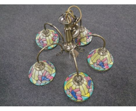 A contemporary five branch light fitting 