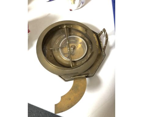 A brass cased calendar compass 