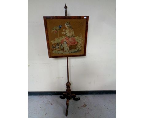 A Victorian rosewood tapestry pole screen 