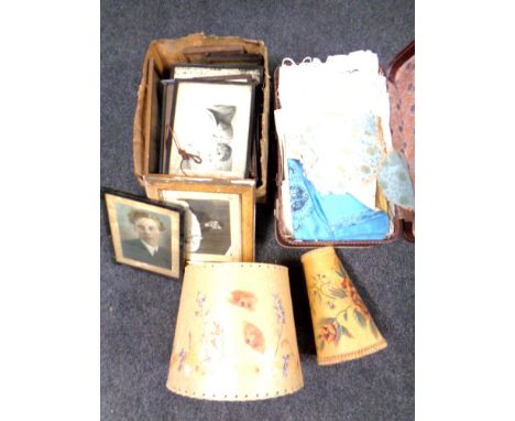 A vintage case containing 20th century linen, lamp shades, box of pictures and prints 