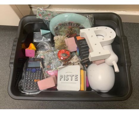 A box containing a lightbox sign with letters, wooden fruit ornaments, books, Super Fast Frisbee, boxed colour changing light