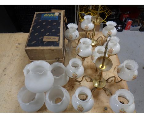 Two brass light fittings with glass shades, five further opaque glass shades, two oil lamp chimneys and a boxed Aldis project