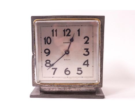 A pewter cased Liberty &amp; Co Tudric clock of squared form with a spot hammered finish, set with a bayard eight day movemen