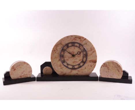 An Art deco 'Odeoneque' style mantel garniture, of clock and side pieces in coloured marble and polished slate, the clock 22c