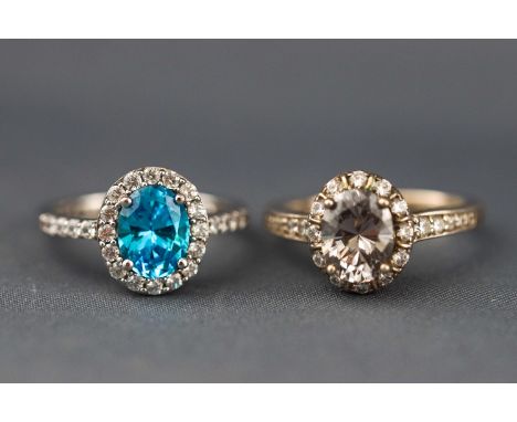 Two white metal cluster rings each set with coloured/white cubic zirconia. Stamped 925 for sterling silver. Size P to Q Gross