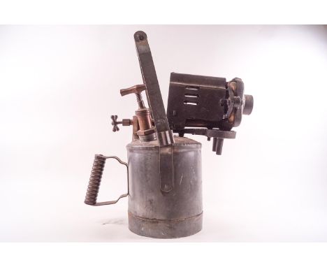 A 20th century metal blow lamp, of large proportions, with a cast iron and brass flame controller and two turned hard wood ha