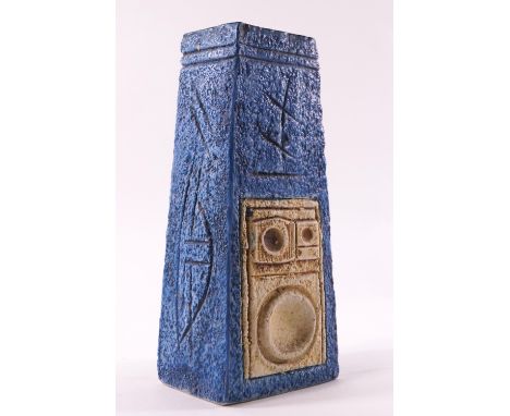 A Troika pottery vase of tapered rectangular form with a blue ground decorated with geometric motifs, one resembling the fron