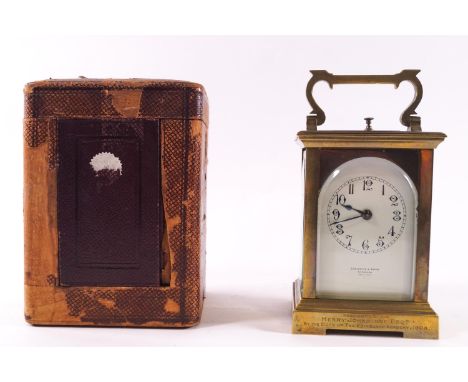 An early 20th century cased carriage repeater clock, retailed by Crichton &amp; Bruce, Edinburgh, with arched topped cream en