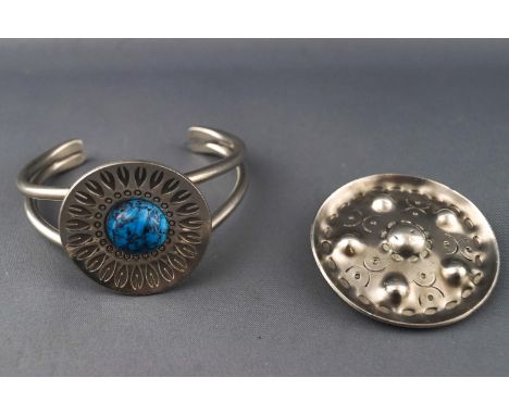 A white metal bangle together with an abstract brooch. Both stamped Pewter Jorgen Jensen handmade - with model numbers. Gross