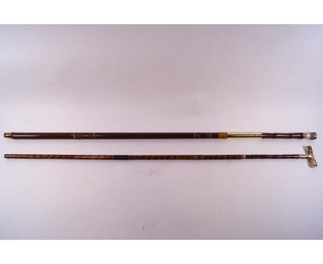A part cane walking stick with a mother of pearl "T" shaped handle with yellow metal mounts stamped 18ct and another with a c