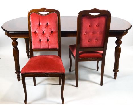 A mahogany and walnut cross banded D end dining table with central marquetry detailing raised on four reeded baluster legs, 7