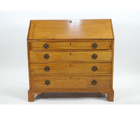 A George III mahogany bureau with fall front (key in reception) over a pair of lopers, the front set with four long drawers a