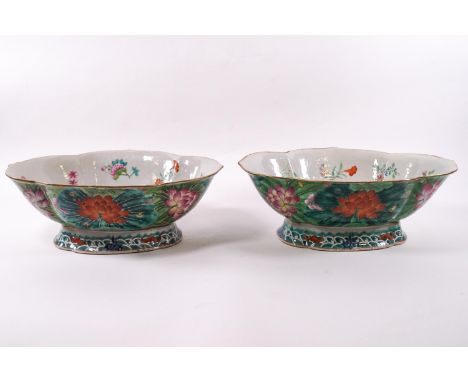 A pair of 19th century Canton enamel lobed bowls, on flared foot, the interior painted with butterflies and flower sprays, th