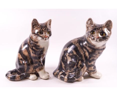 A pair of Winstanley seated ceramic tabby cats with inset glass eyes, the biggest 21cm high