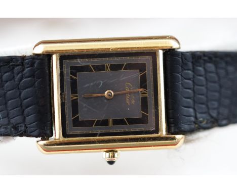 A les must de Cartier  wristwatch. Rectangular dial with Roman numerals. Quartz movement. Gold plated sterling silver case. B