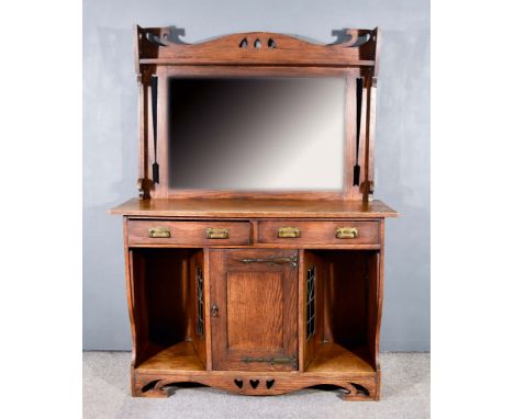A Late 19th/Early 20th Century Oak Sideboard of "Arts &amp; Crafts" Design, the upper part with shaped and cut out upstand an