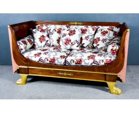 A Mahogany and Parcel Gilt Bateau Lit in the French Empire Style, converted by Michael Westgate, with scroll ends on paw fron