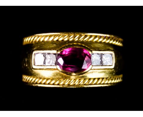 An 18ct Gold Ruby and Diamond Ring, set with a faceted ruby, approximately .50ct, flanked each side by two small brilliant cu