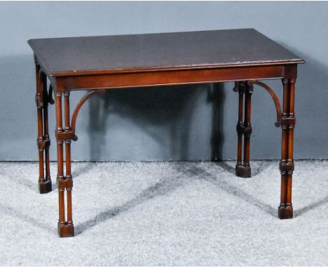 A 20th Century Mahogany Rectangular Occasional Table, of "Victorian Gothic" design, with moulded edge to top, plain frieze, w