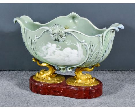 A 19th Century Sevres Pate-Sur-Pate Celadon Glazed Porcelain Oval Two-Handled Jardiniere, of bold shaped outline decorated to