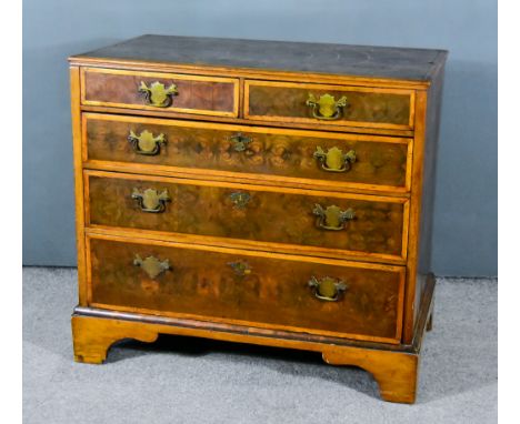 A William and Mary Walnut, Oak and Oysterwood Chest, the oysterwood veneers inlaid with stringings, with moulded edge to top,