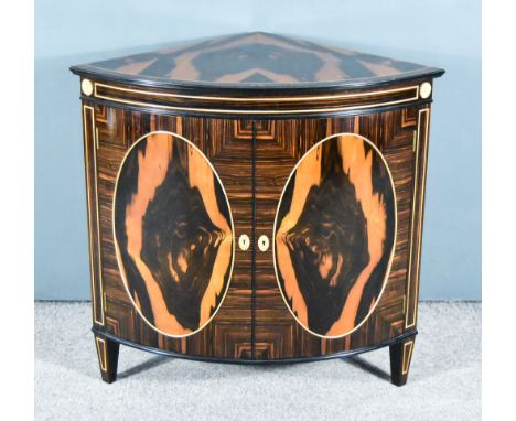 A 20th Century Macasser Ebony and Applewood Detailed Dwarf Bow-Front Corner Cupboard of George III Design, by Michael Westgat