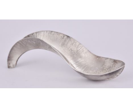 An Elizabeth II Silver "Fold Form" Caddy Spoon, by Nettie Birch London 2018, pure silver standard, of textured form with cent