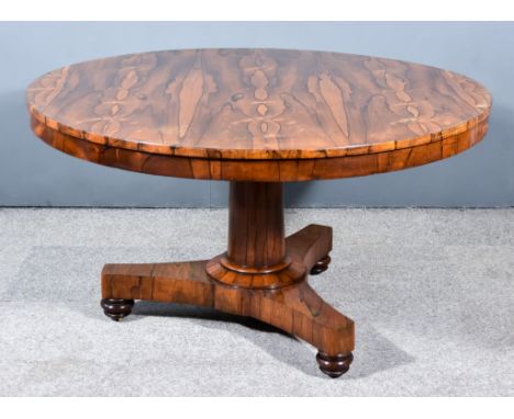 A George IV Highly Figured Rosewood Breakfast Table, with square edge to top, plain frieze, on turned central column and tria