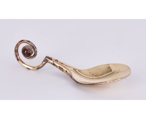 An Elizabeth II Silver Gilt Caddy Spoon, by Anthony Elson, London 2014, with plain bowl, tapered handle with scroll finial se