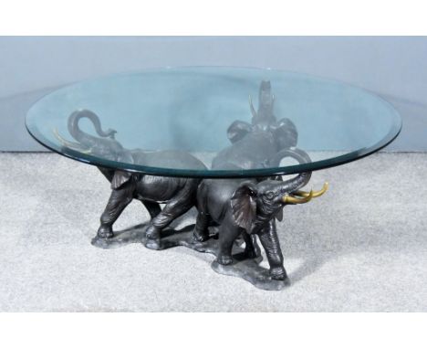 In the Manner of Heinrich Filter - Bronze elephant table with three elephants with raised trunks on naturalistic base support