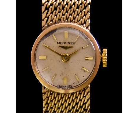 A 9ct Gold Lady's Manual Wind Wristwatch, by Longines, 9ct gold case, 15mm diameter, silver dial with gold baton numerals, in