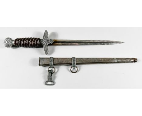 A German Luftwaffe Dress Dagger, by W K of Solingen, 10ins bright steel double edge blade, eagle cross guard, celluloid wire 