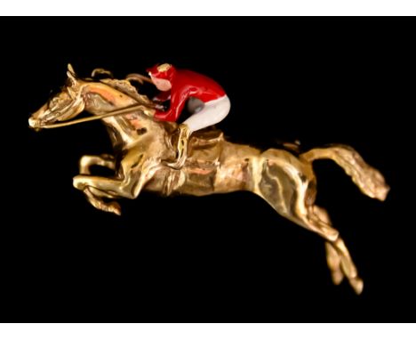 A 9ct Gold Brooch, in the form of a race horse and enamel jockey, 43mm x 20mm, gross weight 12g