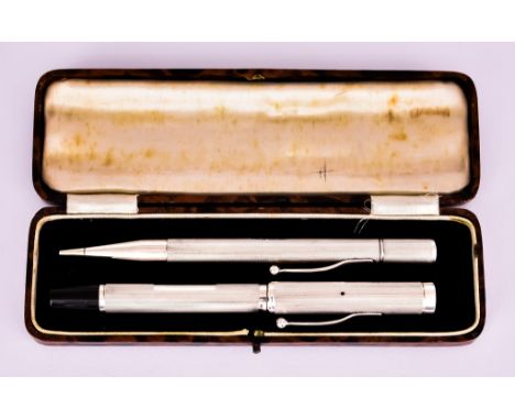 A George V Silver Engine Turned Cased Fountain Pen and Propelling Pencil, by C &amp; C, Birmingham 1941, each with a rectangu