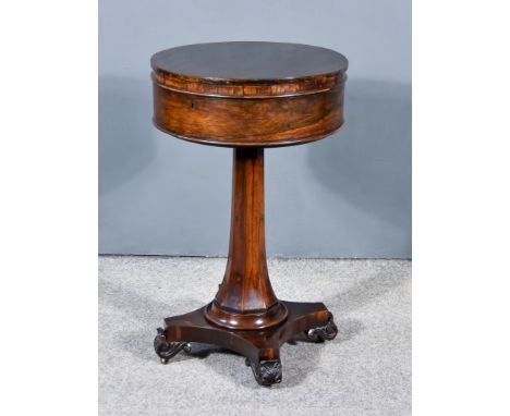 An Early Victorian Rosewood Circular Teapoy, with square edge to top, plain frieze, the pop-up mechanism revealing fitted int