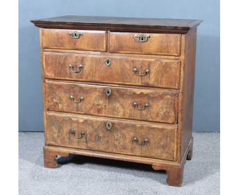 An 18th Century Walnut and Pine Sided Chest, pine top with moulded edge, the front inlaid with cross bandings, fitted two sho