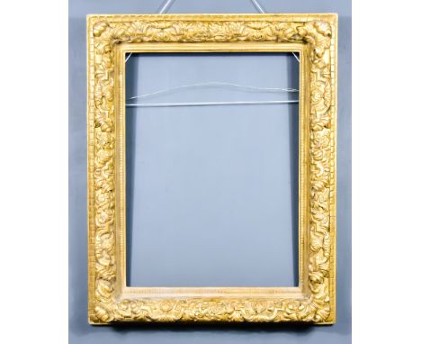 A Gilt Moulded Picture Frame,&nbsp;20th Century, with embossed floral bordering, 32.5ins x 26ins overall, and a pair of gilt 