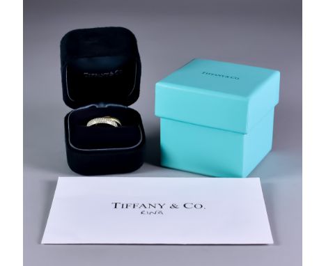 An 18ct Gold Diamond Set Crossover Ring,&nbsp;by Tiffany &amp; Co, model "Melody", by Paloma Picasso, set with small brillian