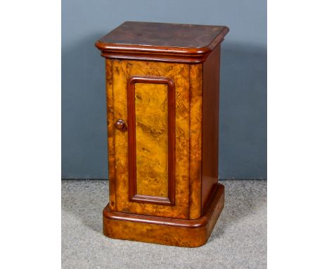 A Victorian Figured Walnut Pot Cupboard, with moulded edge to top, fitted one shelf enclosed by a panelled door, on plinth ba