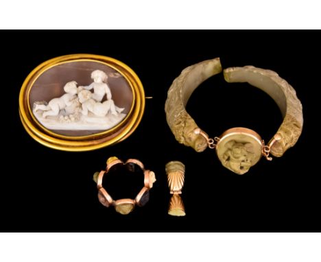 A 14ct Gold Mounted Oval Cameo Brooch, carved with cherubs eating fruit, 65mm x 55mm, a 14ct gold mounted lava rock bracelet,