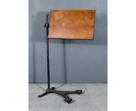 A Victorian Oak and Cast Iron Adjustable Reading Stand, with adjustable slope to top, on central column surmounted by reeded 