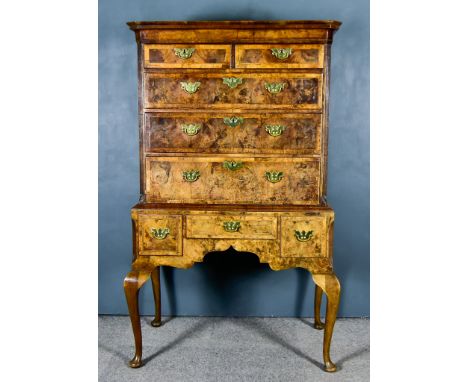 An 18th Century Figured Walnut Chest on Stand, the upper part with moulded cornice, plain frieze, the front crossbanded and i