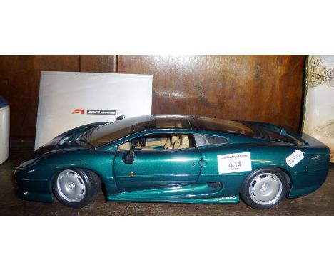 A Maisto 1/12 scale model of an XJ220 in green livery
