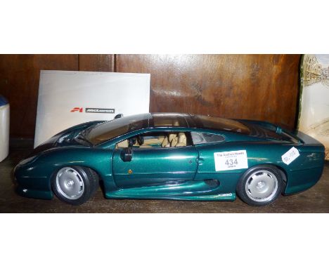 A Maisto 1/12 scale model of an XJ220 in green livery